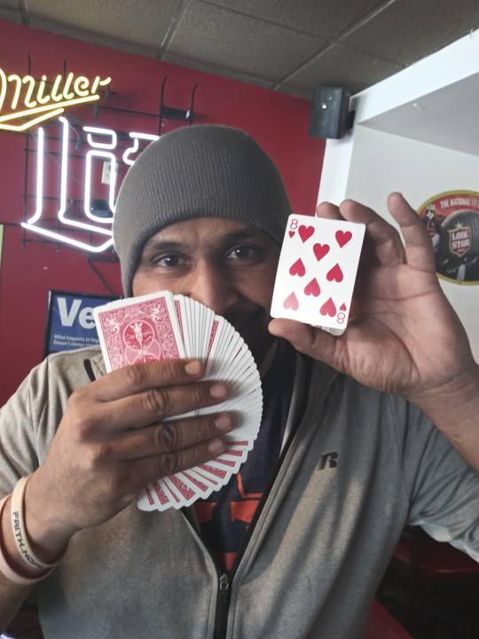 Alex Others, aka “Sideshow Shane,” regularly performs magic tricks on the porch at Kampus Korner. Others has been performing for 12 years. UP photo by Jason Hebner