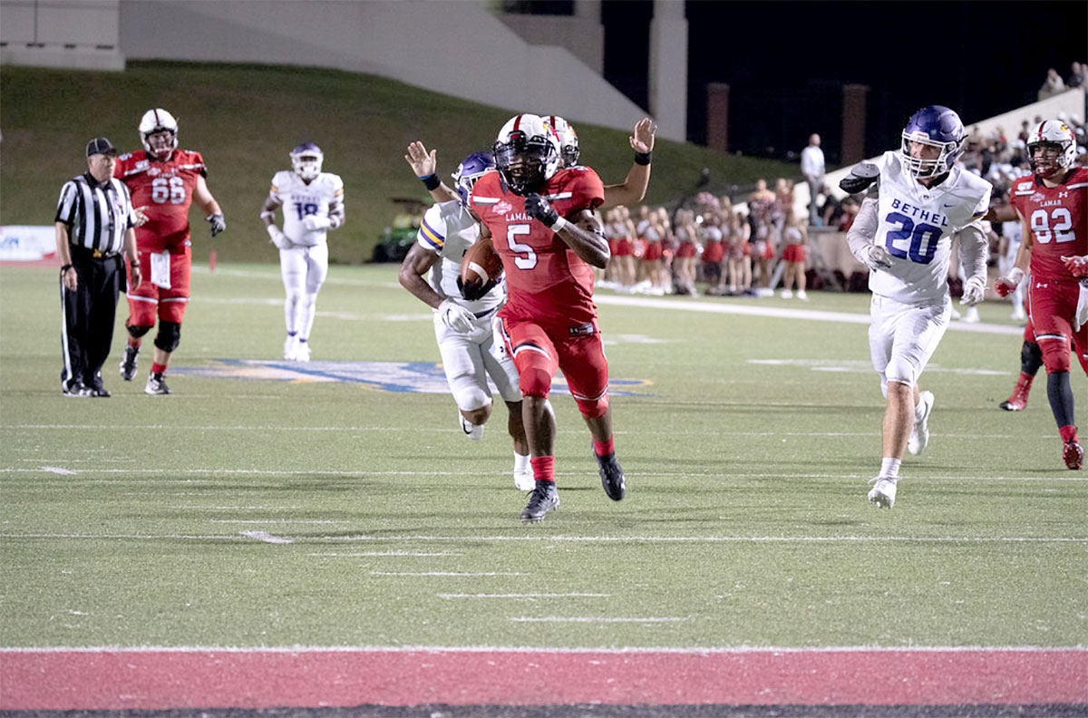 LU running back Myles Wanza runs the ball in for a touchdown at Provost Umphrey Stadium, Thursday. UP photo by Noah Dawlearn