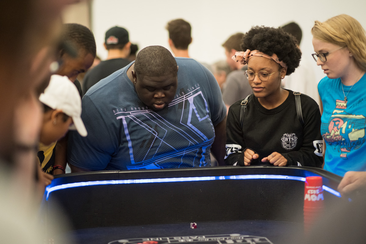 Lamar Student rolls the dice for a game of craps inside the ball room of the Setzer Student Center on Aug 28.