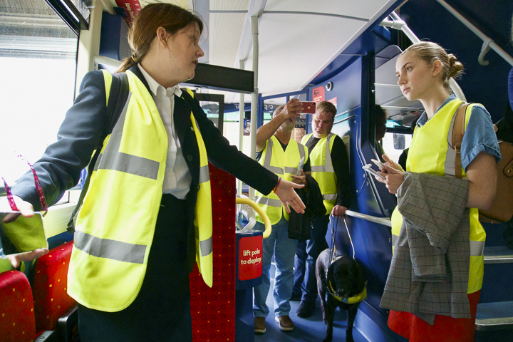 Victoria Garcia, gives Lamar study abroad students a tour of a typical Brighton & Hove bus, showcasing its accessibility features. Every Brighton & Hove bus driver, above, goes through special training in order to assist customers. Each is required to know how to use the manual wheelchair ramp for their bus.UP photos by Abigail Pennington