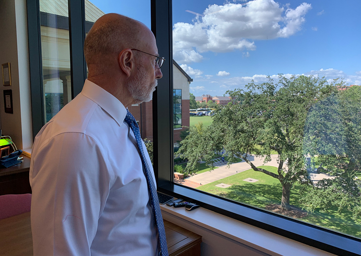 President Kenneth Evans looks out at the campus from his office in the Reaud Building, following Tropical Storm Imelda, Sept. 24, 2019. Tuesday. UP photo by Olivia Malick