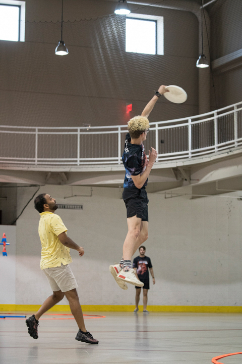 A student catches a frisbee in the Sheila Umphrey Recreational Sports Center Indoor Soccer Arena, Aug 27. UP photo by Noah Dawlearn