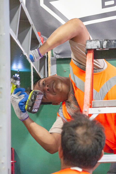 Cotton team workers, Lamar contractor, unscrewing boards to check for damage in the Tex and Emma Strait Baseball Training Facility on Sep 23. Tropical Storm Imelda brought up to 40 inches of rain in some areas of Southeast Texas.