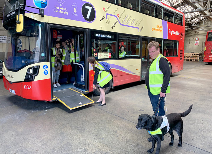Daniel Walker and his guide dog, Pebble, right, tour a Brighton & Hove bus which is necessary for his independence. UP photo by Olivia Malick