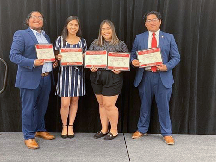Cesar Delgado, junior, left, Jennifer Caltzontzi, senior, Melissa Torres, senior, and Julio Delgado, senior, were honored for their contributions to the Lamar Latinx community at the Annual Excellence Banquet, Oct. 4