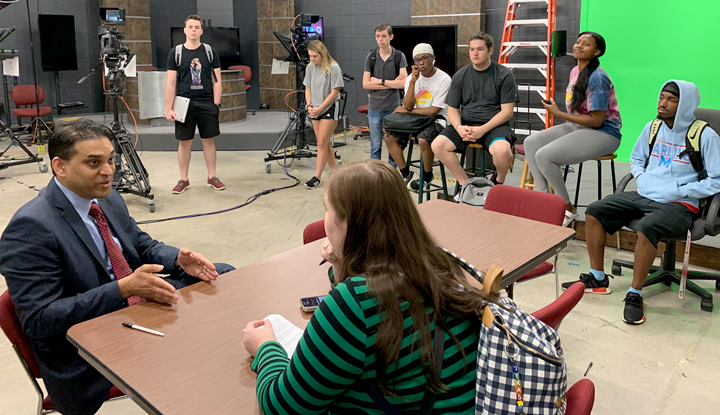 Texas Tribune editor Ayan Mittra, left, speaks with students about the changing media landscape, Monday, in the LUTV studio.