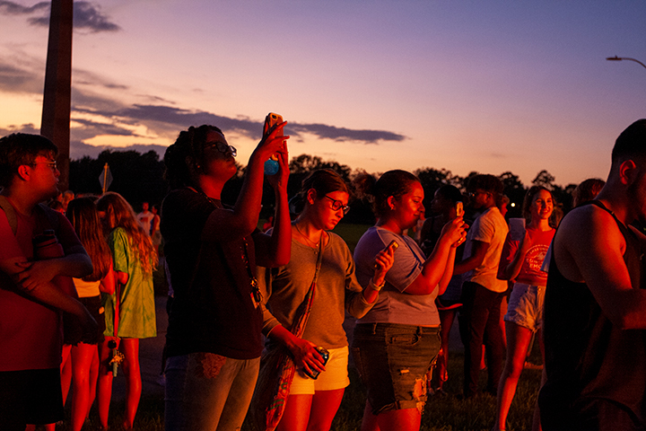 Students reflect the flames during Lamar University's Pep Rally and Bonfire, Sept. 27. UP photo by Noah Dawlearn