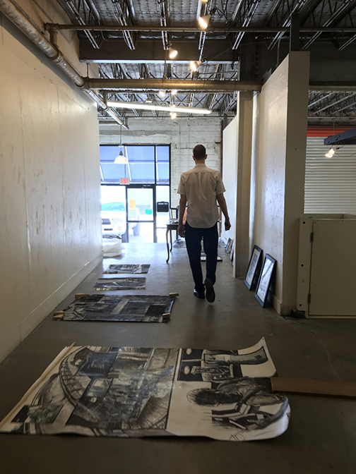 Troutman overlooks his artwork.