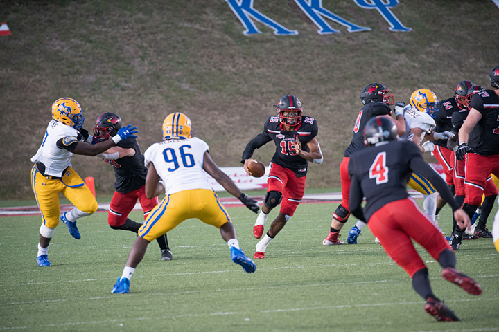 LU quarterback, Shane Johnson, scrambles towards the endzone during Saturday's game at Provost Umprehy Stadium. UP photo by Noah Dawlearn