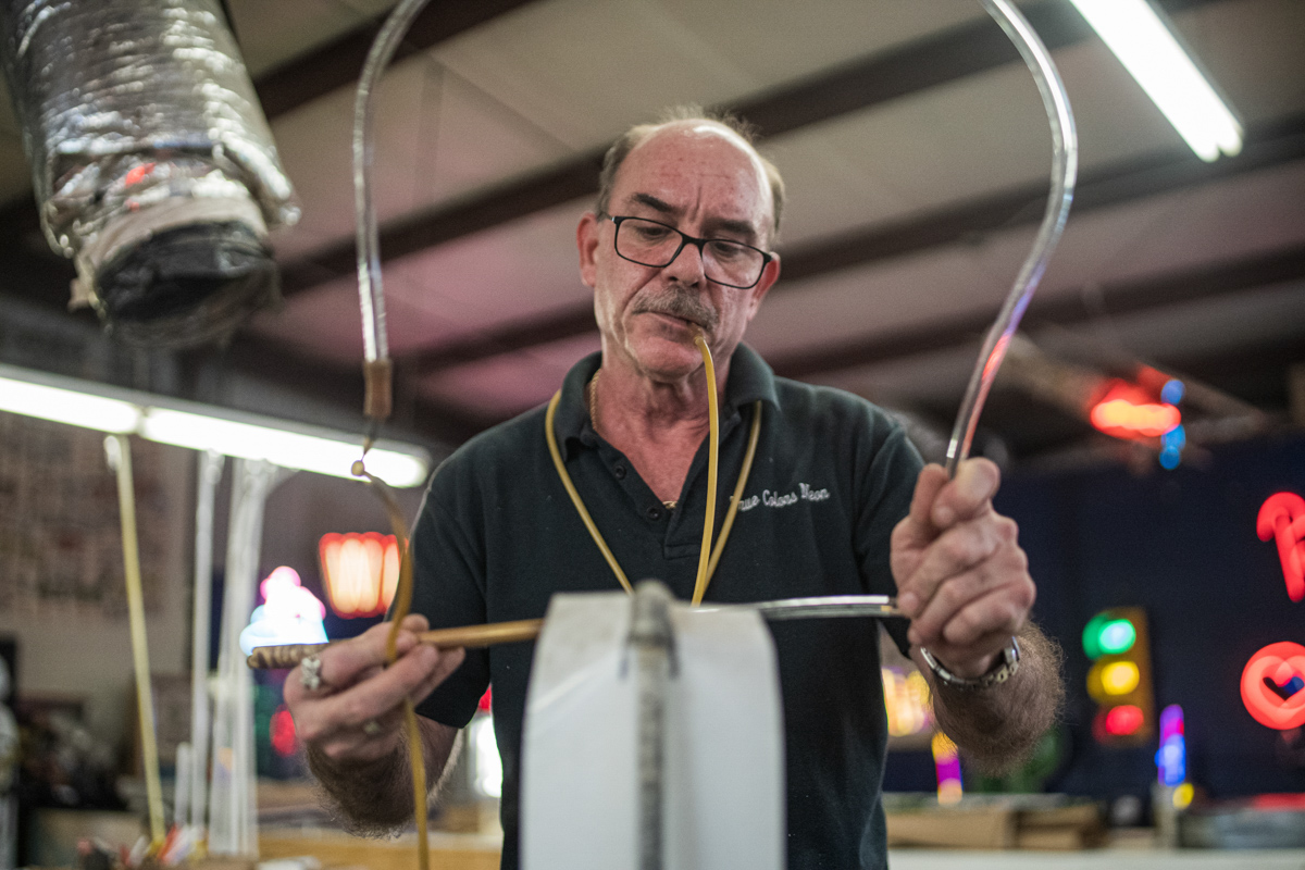 Dobelmann heats up the glass to form the shape that is needed for the design. UP photo by Noah Dawlearn