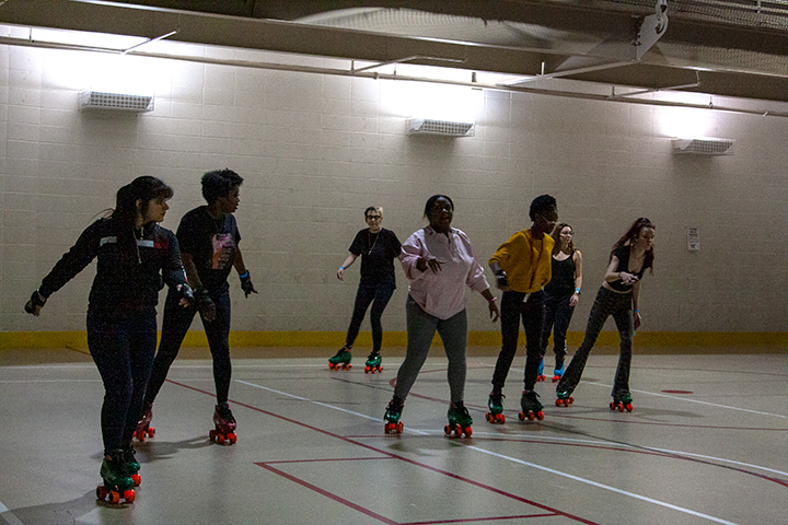 Edwin, the yoga instructor, teaches the class certain poses at Late Night at the Rec on Jan. 24 in the Sheila Umphrey Recreational Center. UP Photo by Delicia Rocha.