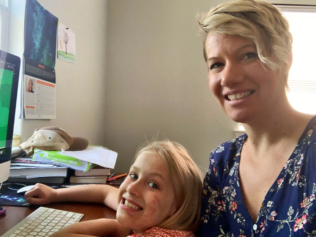 LU student Hayley Snyder and her daughter work on school projects.