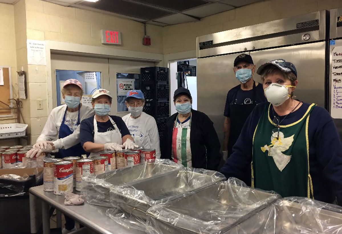 Volunteers and staff at Some Other Place prepare to pass out meals. Courtesy photo