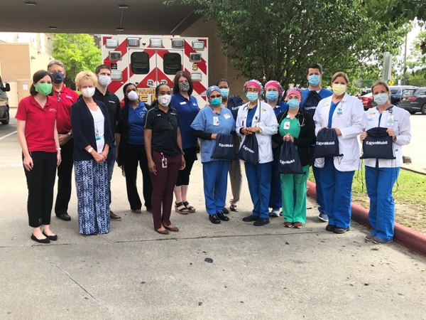 ExxonMobil donated care packages to frontline healthcare professionals at Christus and Baptist Hospitals in collaboration with the Lamar Institute of Technology, the Greater Beaumont Chamber of Commerce, and the Beaumont Independent School District. A group of nurses pose with the care packages outside of Baptist Hospital of Southeast Texas in Beaumont on May 4, 2020.