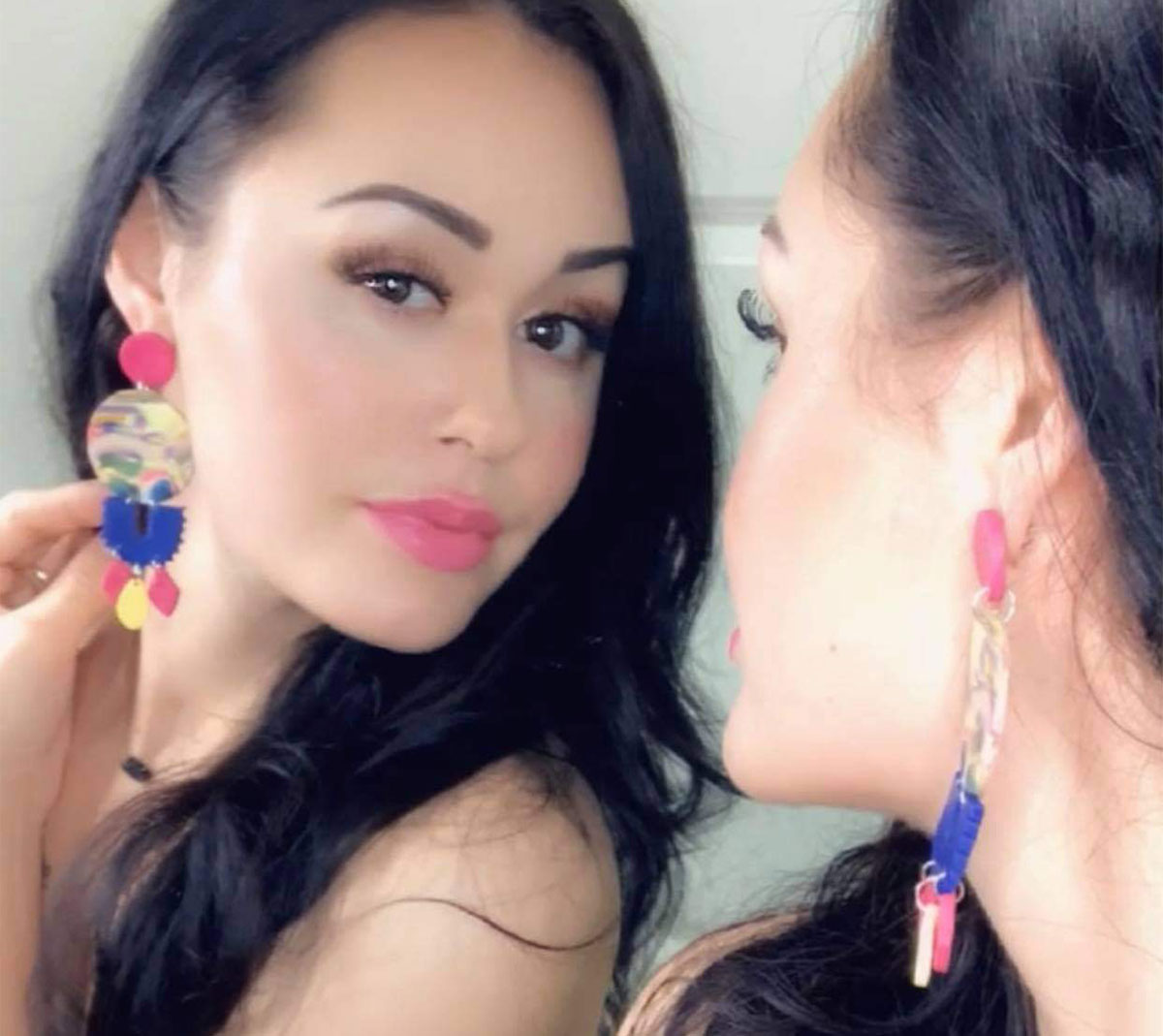 Candace Poole shows off her earrings which she sells through her business, "Minerva Luxe." Courtesy photo