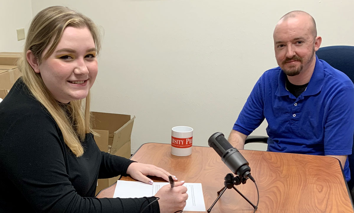 Olivia Malick and Chris Moore prepare to record an episode of "What's Up."