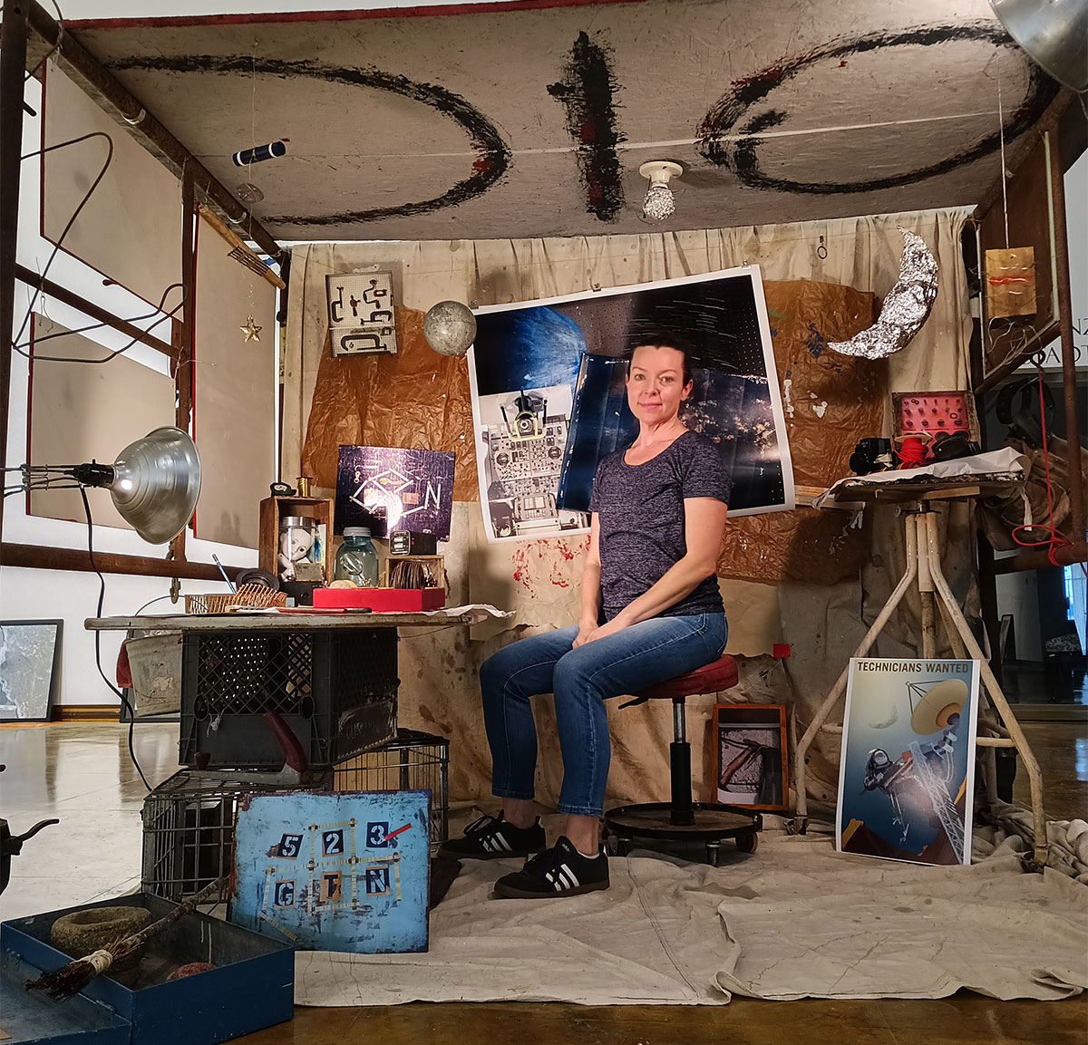 Brandi Hamilton sits in her installation, "Technicians of New meaning," part of the senior thesis show which opens April 30.