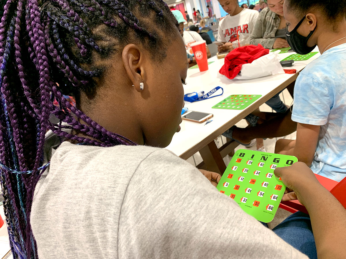 Nicole Eze, Baytown sophomore, checks her card during Bingo Night, Aug. 24, in the Setzer Student Center. UP photo by Havalyn Crawford