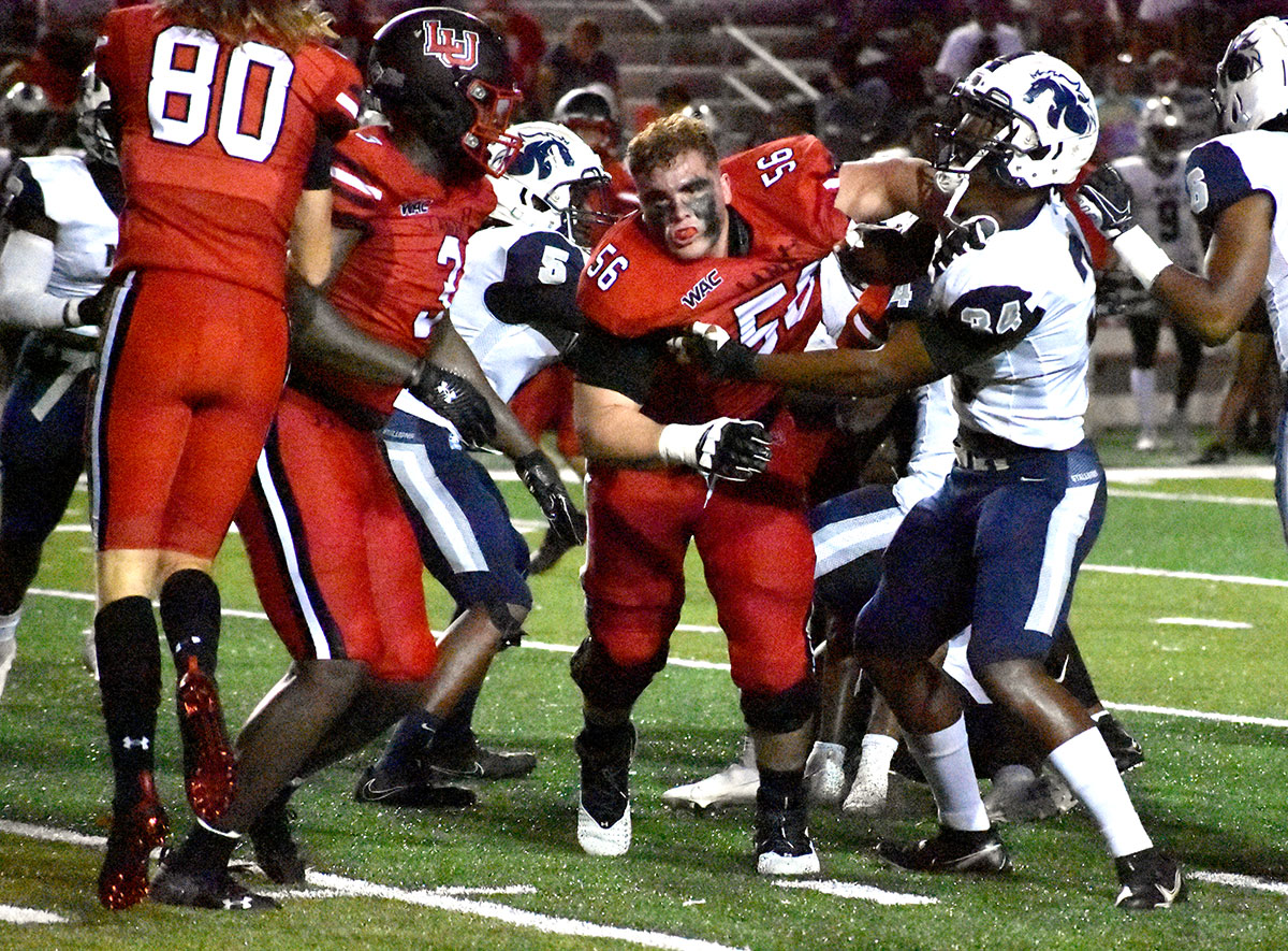 LU's Addison Shackelford loses his helmet during after scoring touchdown during LU's 47-3 win over NAU at Provost Umphrey Stadium, Sept. 2. UP photo by Keagan Smith