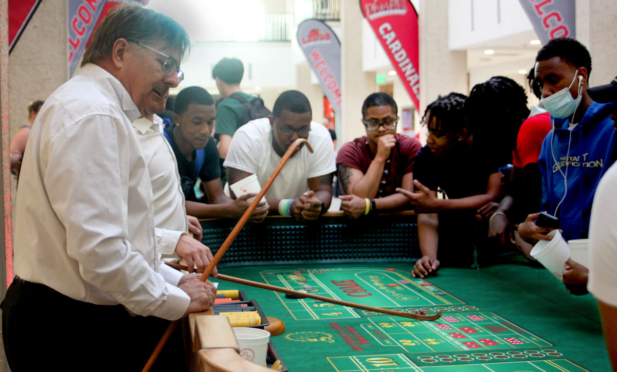 Students play craps during Casino Night, Aug. 23, in the Setzer Student Center. UP photo by Ambour Leal