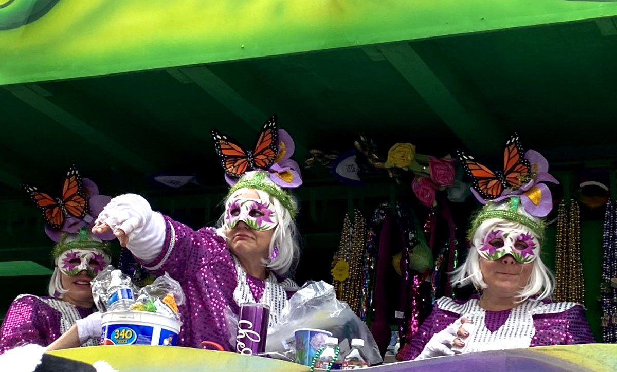 Participants throw beads from a during New Orleans Mardi Gras, Feb. 26. UP photo by Maddie Sims