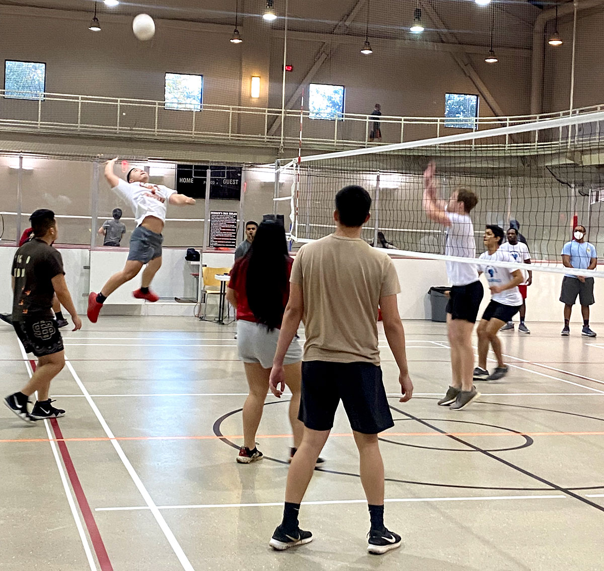 Jimmy Trinh, of team Gremlins, rises to spike the ball during the Co-Rec volleyball tournament, Feb. 28, in the Sheila Umphrey Recreational Sports Center. UP photo by Clarissa Hernandez
