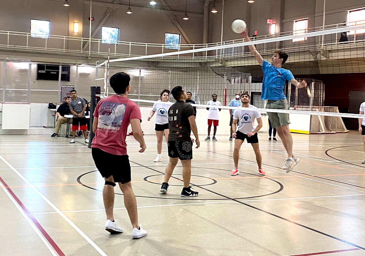Team HHC spikes the ball during the Co-Rec volleyball tournament, Feb. 28, in the Sheila Umphrey Recreational Sports Center. UP photo by Clarissa Hernandez