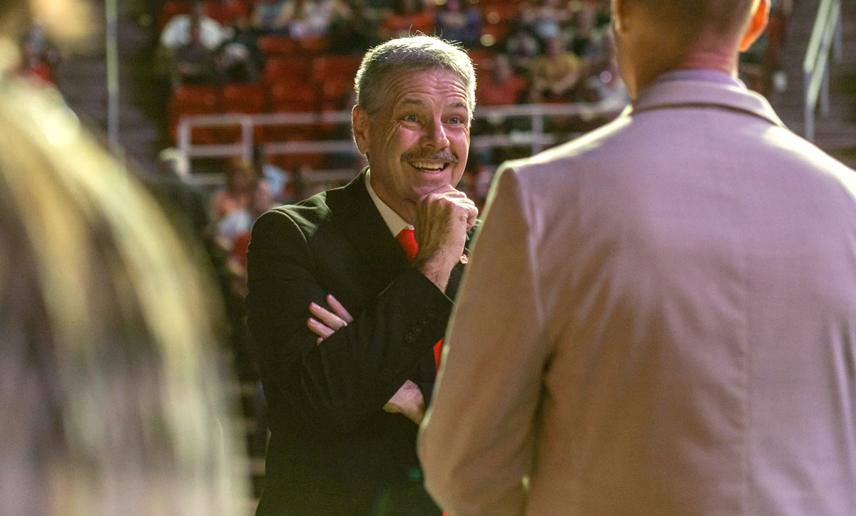 Lamar University President Jaime Taylor chats with a faculty member prior to his 2022 Convocation address in the Montagne Center, Aug. 16. UP photo by Brian Quijada