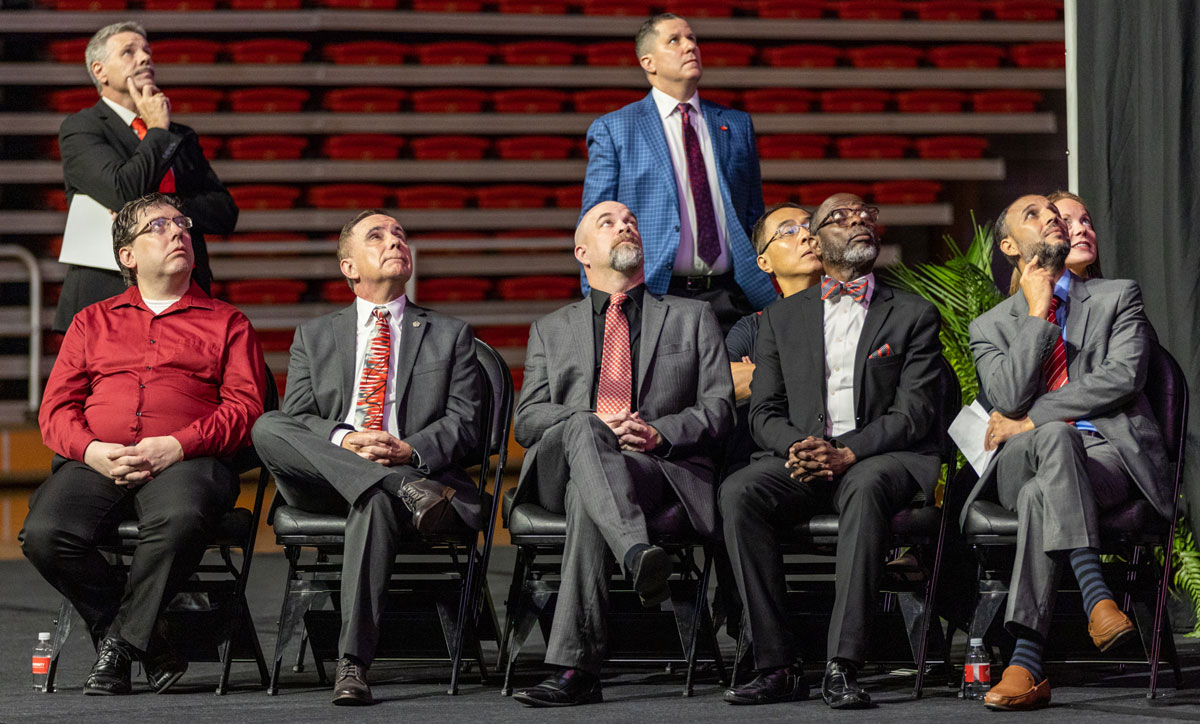 Lamar University President Jaime Taylor, back left, watches a video with other administrators during 2022 Convocation  in the Montagne Center, Aug. 16. UP photo by Brian Quijada