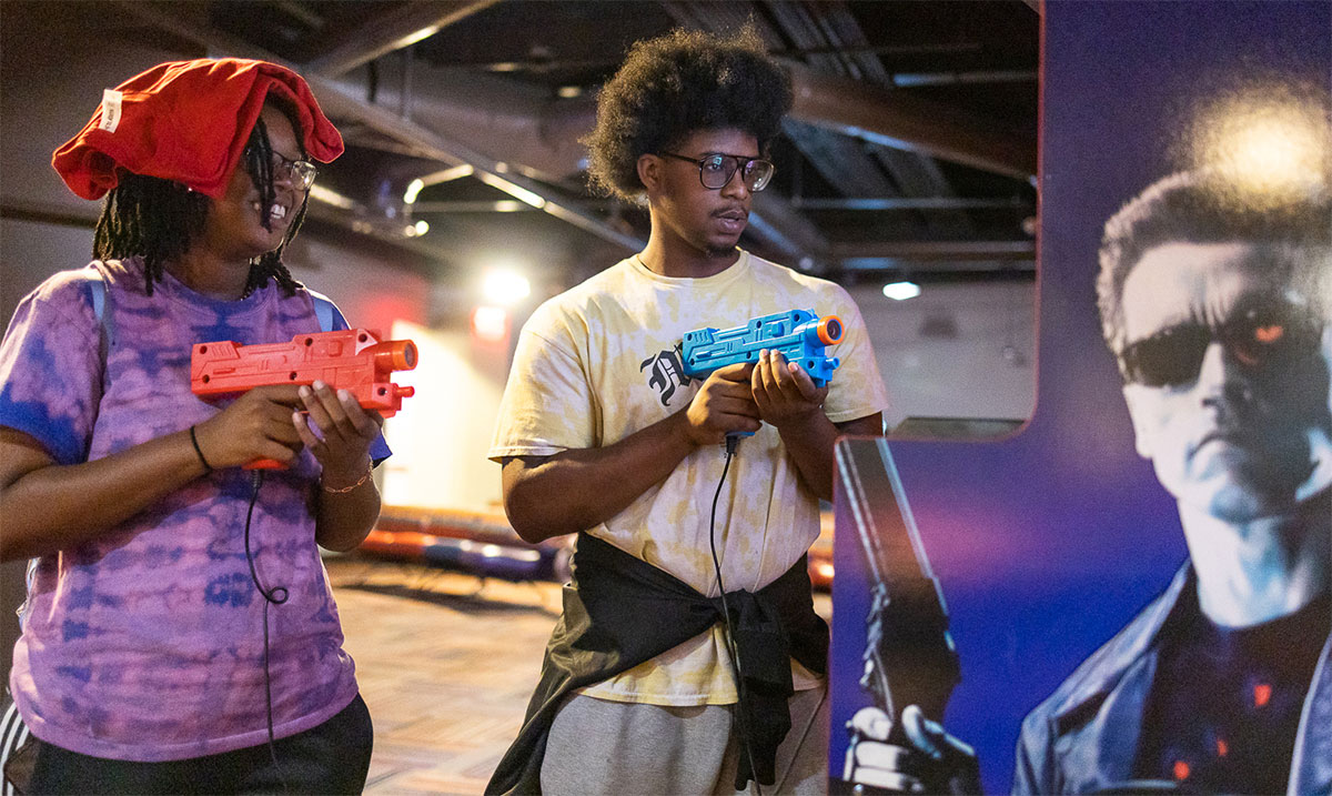 Kate and Preston play “The Terminator” at the Retro Arcade event in the Sheila Umphrey Recreational Sports Center, Sept. 29. UP photo by Brian Quijada.