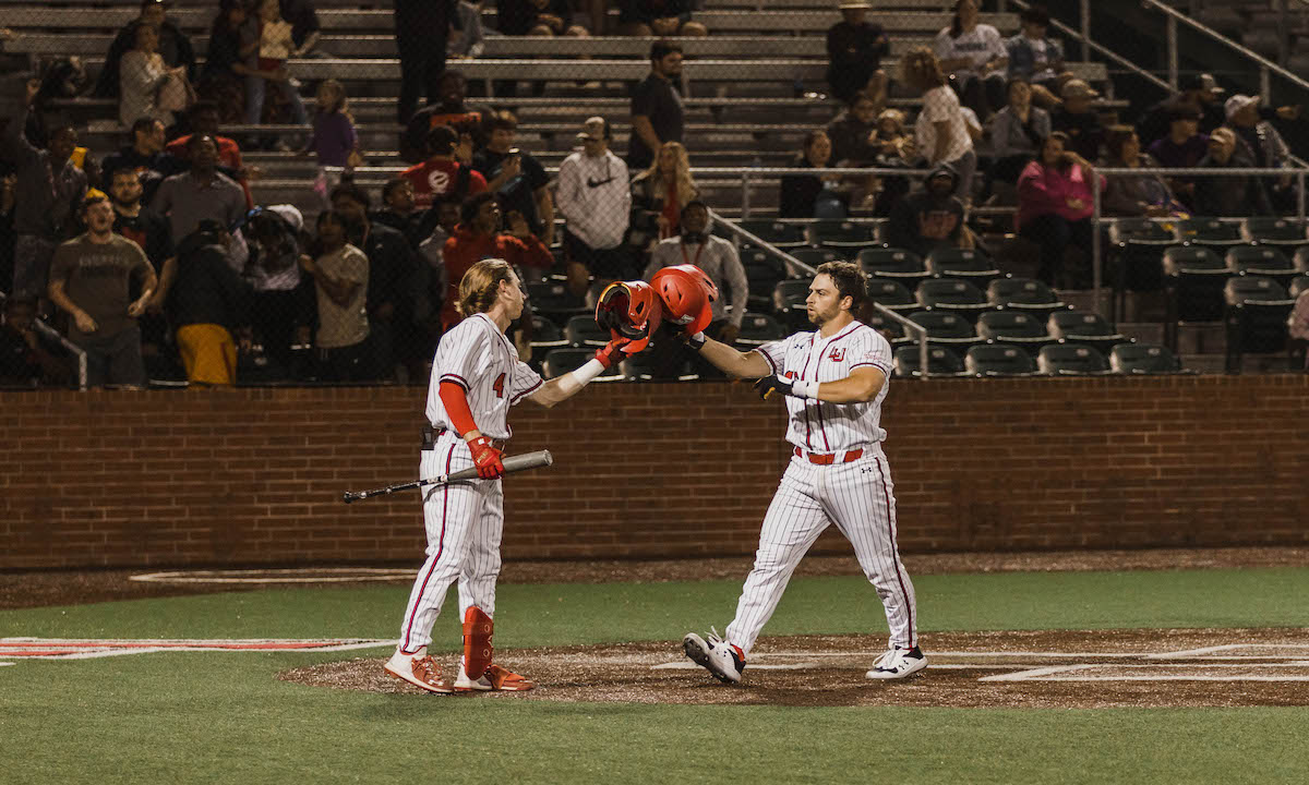 Ben MacNaughton and Kyle Harper celebrate following Harper's home run.