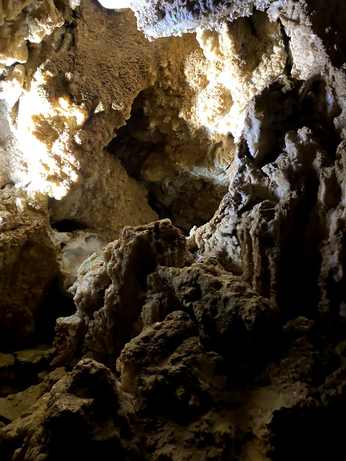 Rock formations reach up to the ceiling.