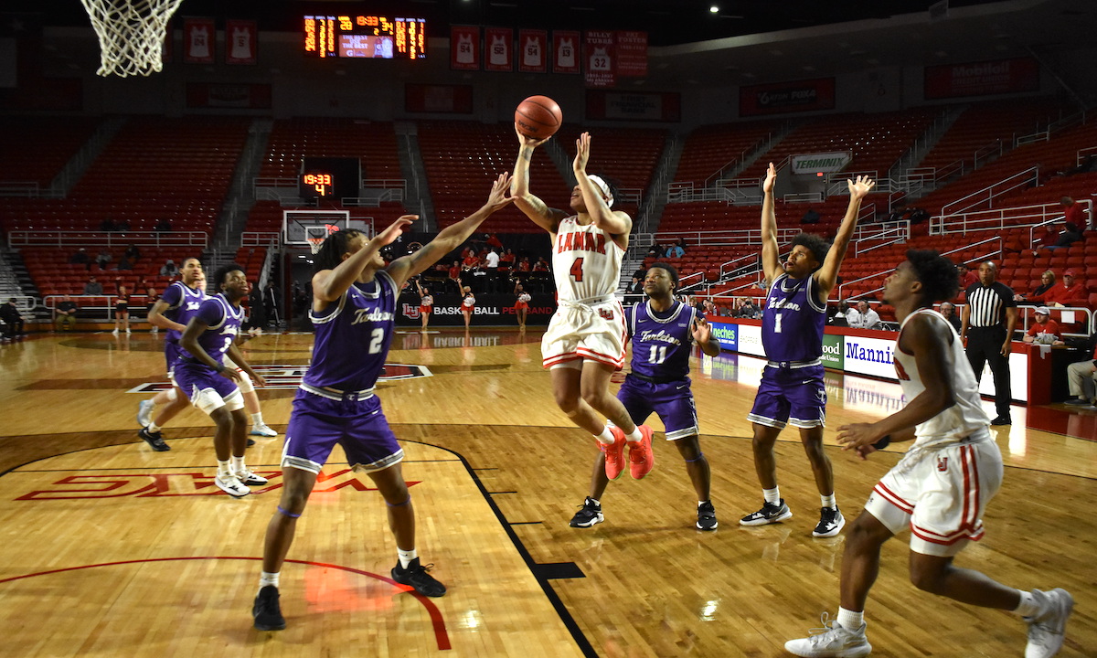 Lamar's Kasen Harrison shoots over a Texans' defender on Jan. 26. Photo credit: Keagan Smith, UP sports editor..