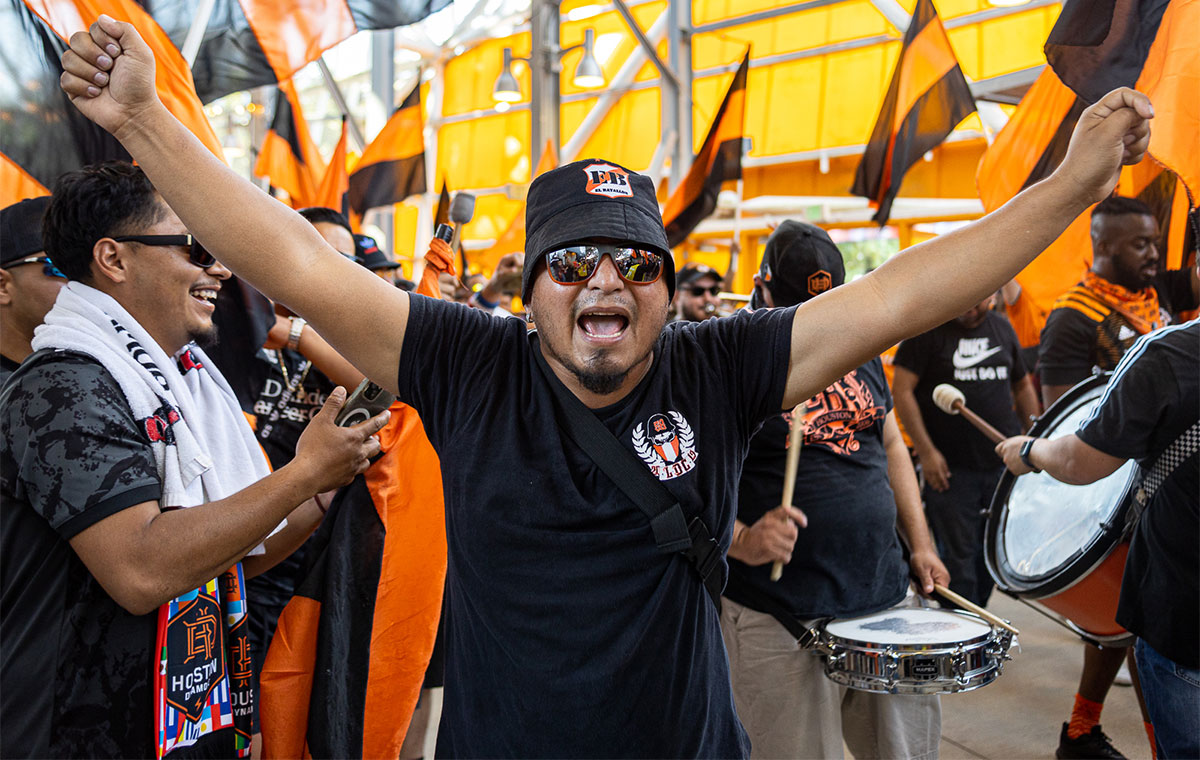 A member of El Batallon yells a chant during their performance before the match at PNC stadium in Houston, Oct. 9. UP photo by Brian Quijada.
