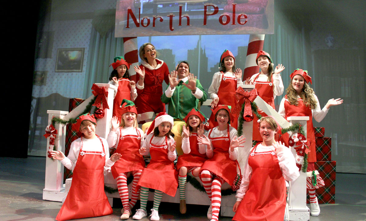 Adam Conrad (Buddy) and Christina Maldonado (Jovi) pose with the elves in "Elf The Musical" through Dec. 18.