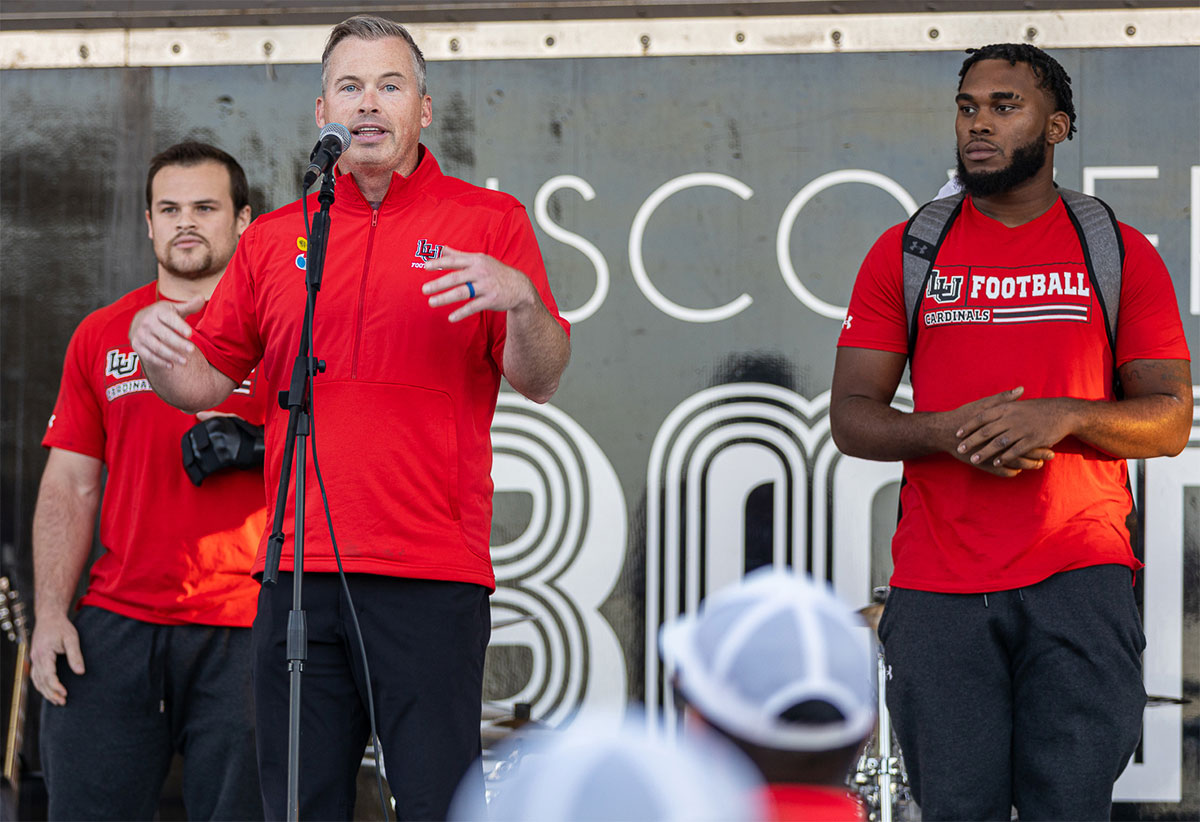 Football coach Blane Morgan and players speak during the bonfire and pep rally at The Spindletop-Gladys City Boomtown Museum, Sept. 30. UP photo by Brian Quijada. 