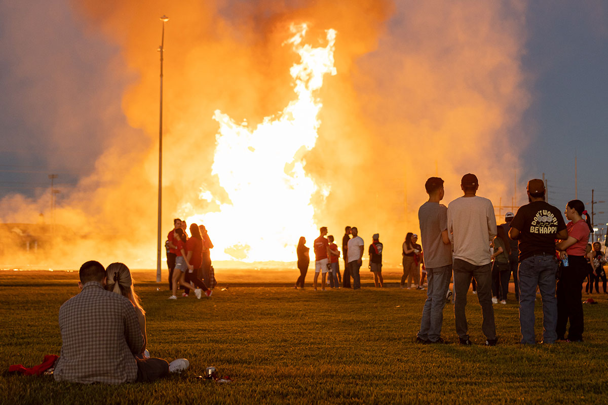 Students gather around the bonfire during the Homecoming pep rally at the Spindletop-Gladys City Field, Sept. 30. UP photo by Brian Quijada.