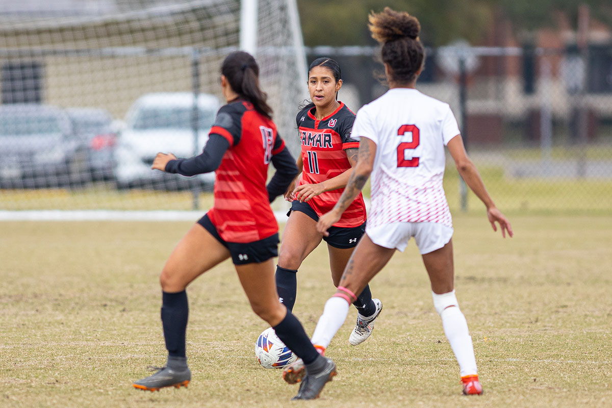 Lamar forward Miranda Urbizu dribbles the ball against a Nicholls State defender, Oct. 28, at Lamar University Soccer Complex. UP image by Brian Quijada.