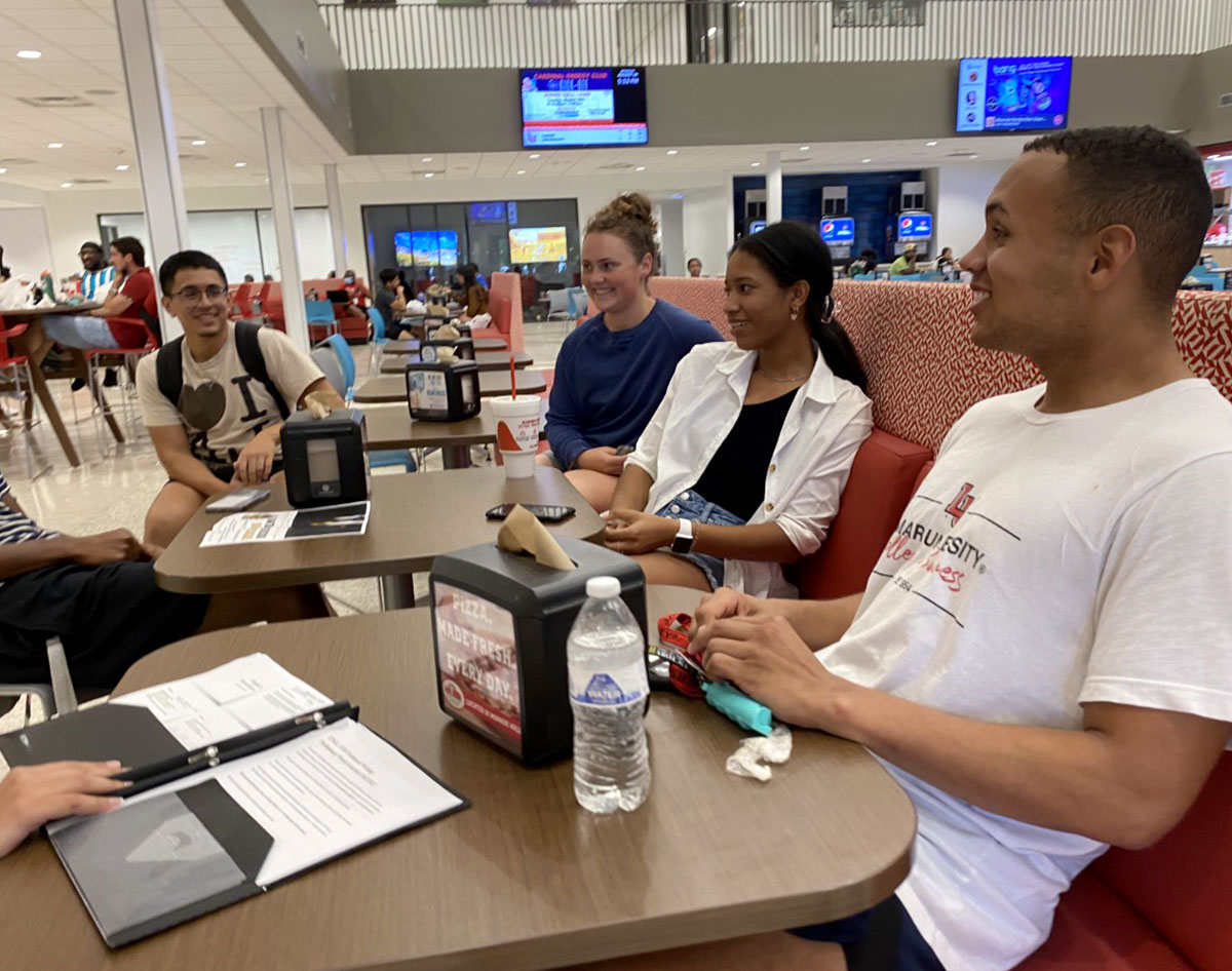 Christian Guillory talks with his friends at the Setzer Student Center. UP photo by Maddie Sims.