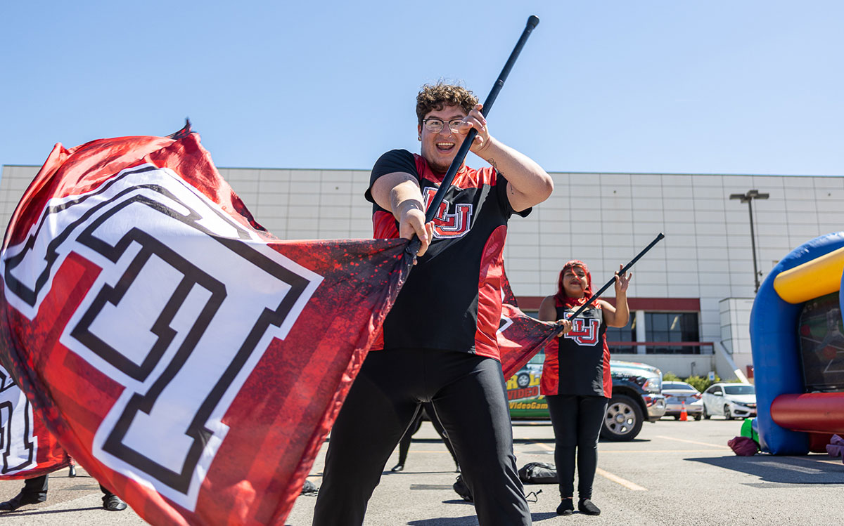 A member of the LU color guard performs during the Homecoming tailgate at the Montagne Center parking lot, Oct. 1. UP photo by Brian Quijada.