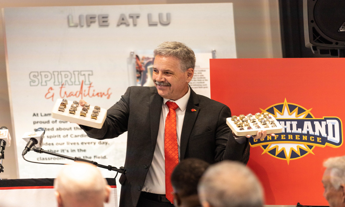 Lamar president Jaime Taylor holds Southland Conference championship rings gifted to him at the announcement press conference, April 8.