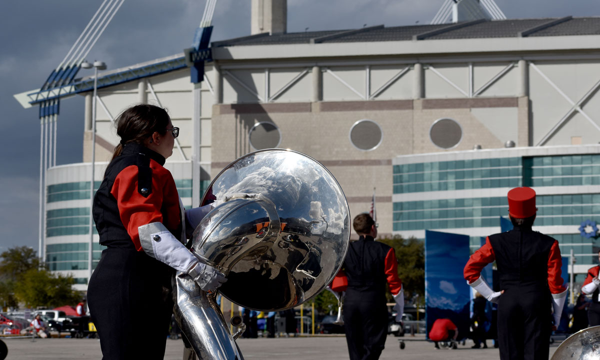 Maddie Sims stares at the Alamodome with her tuba. UP photo by Keagan Smith.