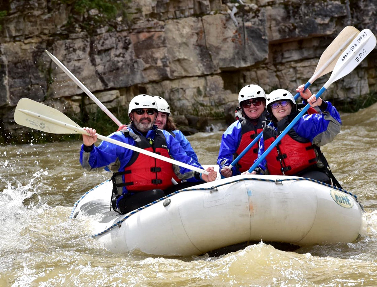 My family and I whitewater rafting across the river.