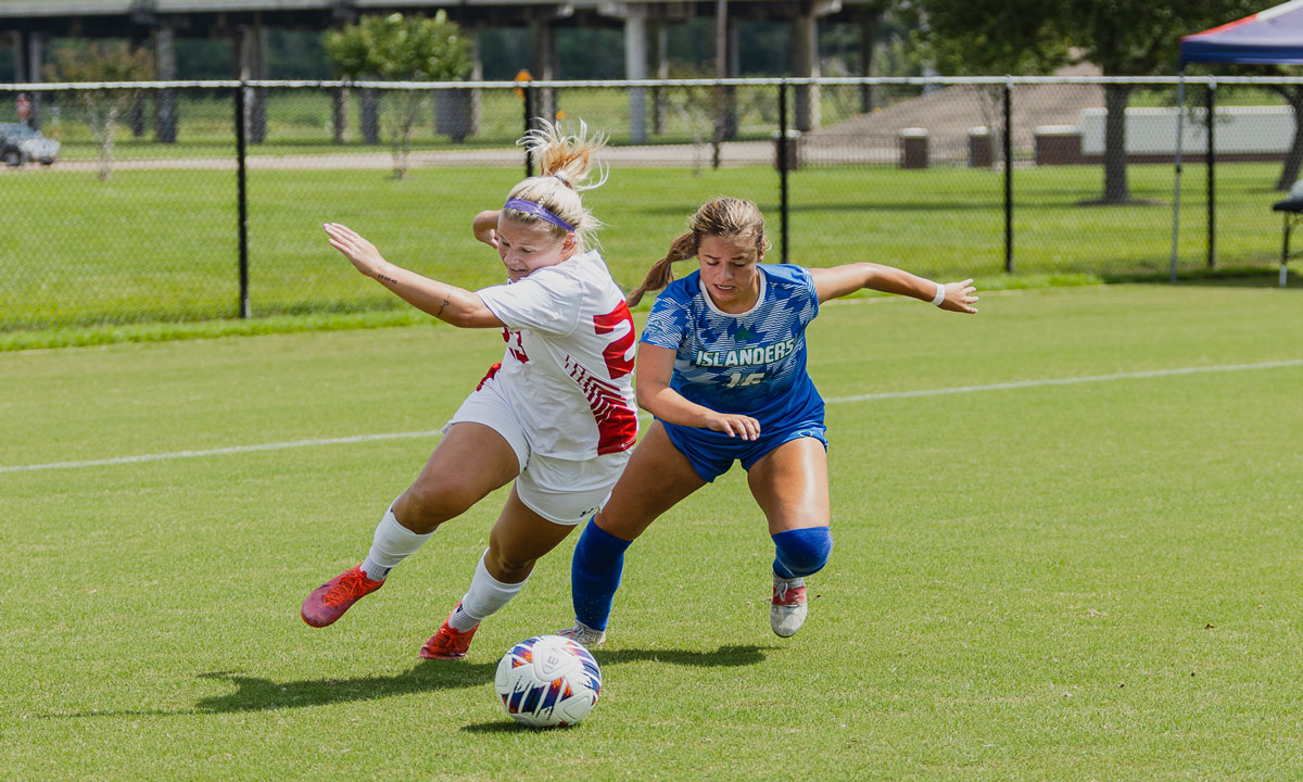 Cardinal midfielder Eva Karen fights for possession of the ball against TAMUCC Islander, Sep 11, at Lamar University Soccer Complex. UP image by Brian Quijada.