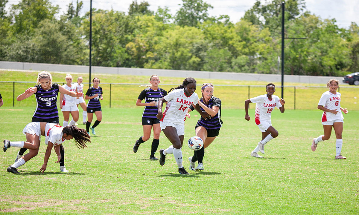Lamar forward Cariel Ellis staves off a Tarleton State defender for control of the ball, Aug 28, at Lamar University Soccer Complex. UP image by Brian Quijada.