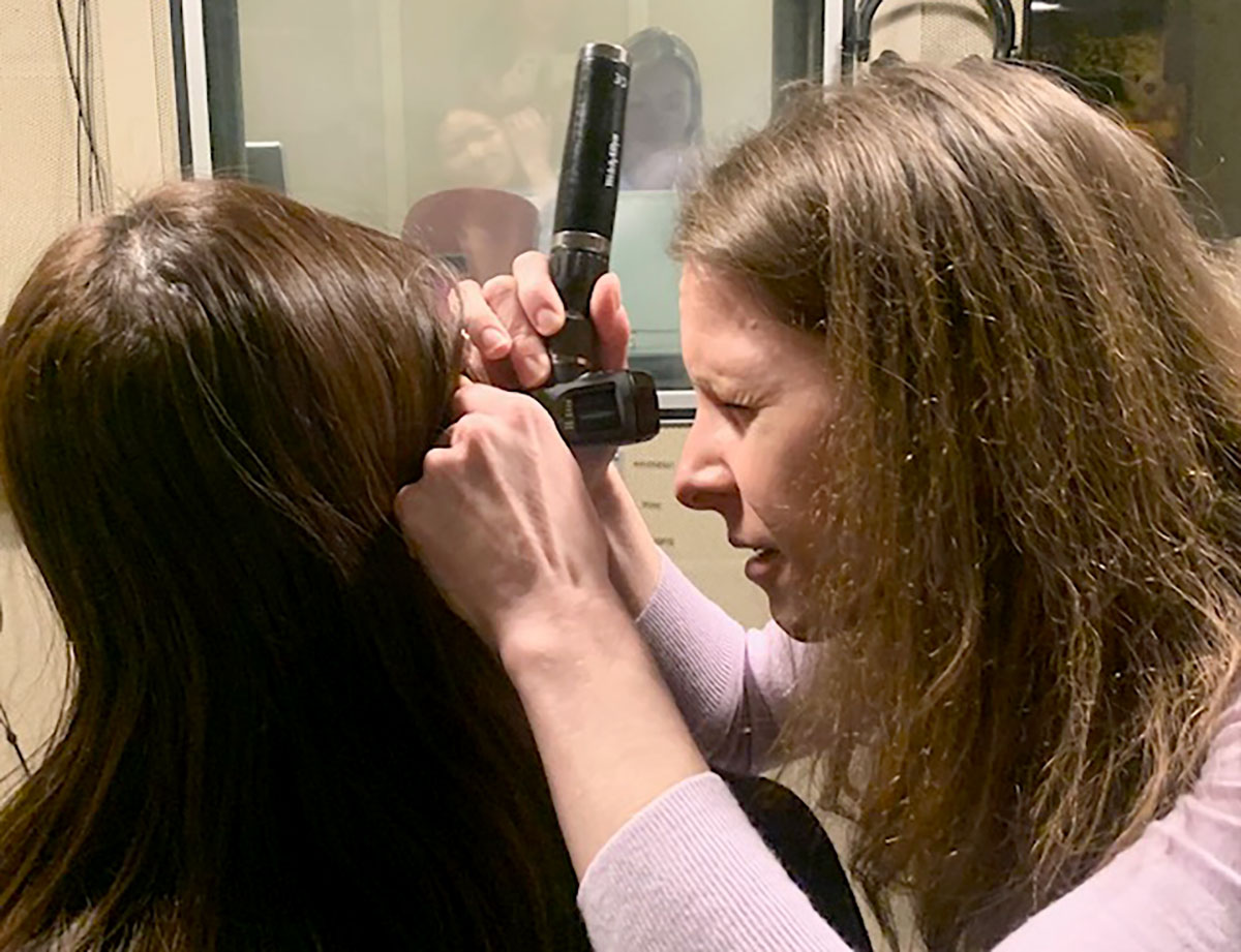 Audiologist Anna Jilla checks student Anna Truong in the Speech and Hearing Clinic, Feb. 6. The clinic is offering free tinnitus testing for students through Feb. 13. UP photo by Abi Patterson