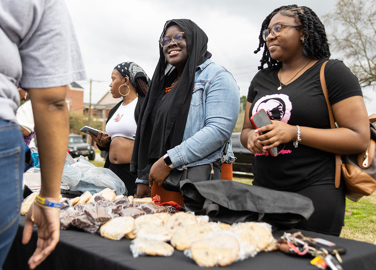 Members of the Woman to Woman organization sold pastries at the Black History Month Block Party, Feb. 24, at Cardinal Park. UP photo by Brian Quijada.