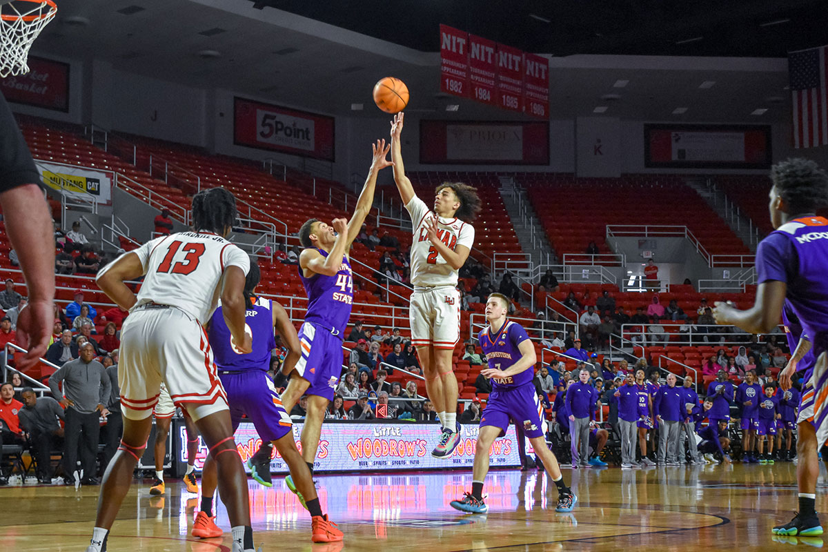 LU guard Nate Calmese floats the ball up against Northwestern State defender, Feb. 4, at the Montagne Center. UP image by Keagan Smith.
