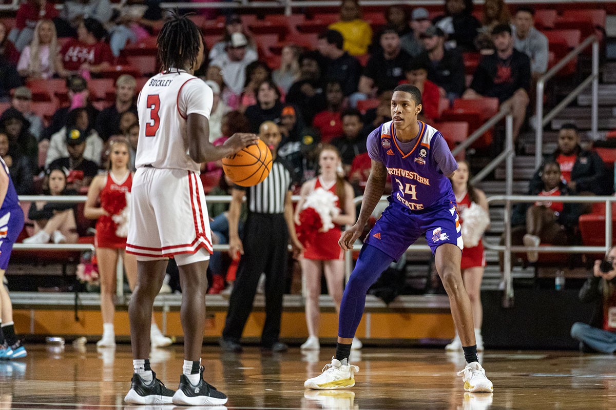 Lamar guard Jakevion Buckley is guarded by Northwestern State’s Hansel Enmanuel, Feb. 4, at the Montagne Center. UP image by Brian Quijada.