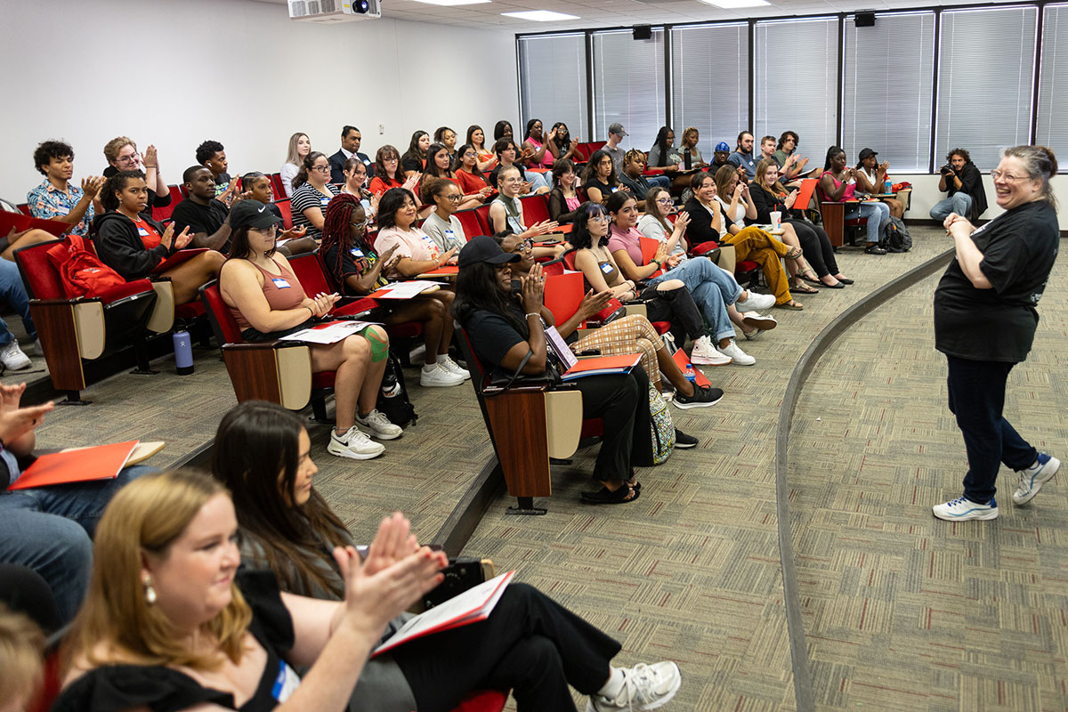 Interim Department Chair Nicki Michalski speaks to students at the COMM-Unity event in the Communications Building, Aug. 22. UP photo by Brian Quijada.